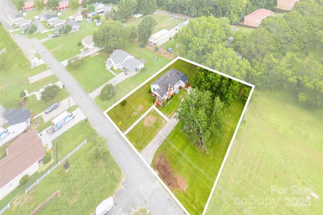 410 Gann St, Lowell, NC 28098 - aerial perspective of suburban area featuring property boundaries highlighted