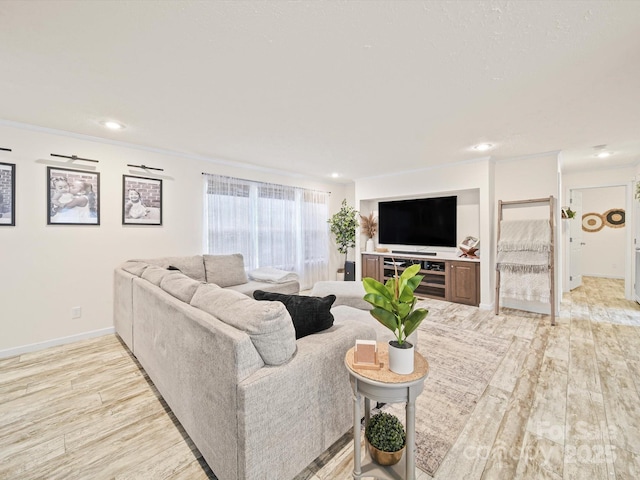601 Lhasa Apso Ln, Iron Station, NC 28080 - living room featuring light wood finished floors, recessed lighting, and crown molding