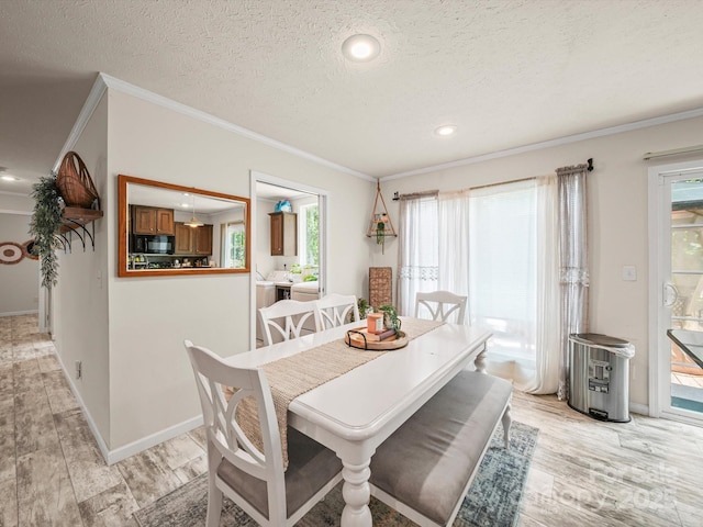 601 Lhasa Apso Ln, Iron Station, NC 28080 - dining area with crown molding, plenty of natural light, light wood-style flooring, a textured ceiling, and recessed lighting