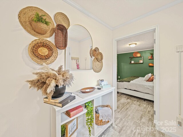 601 Lhasa Apso Ln, Iron Station, NC 28080 - corridor with crown molding and wood finished floors