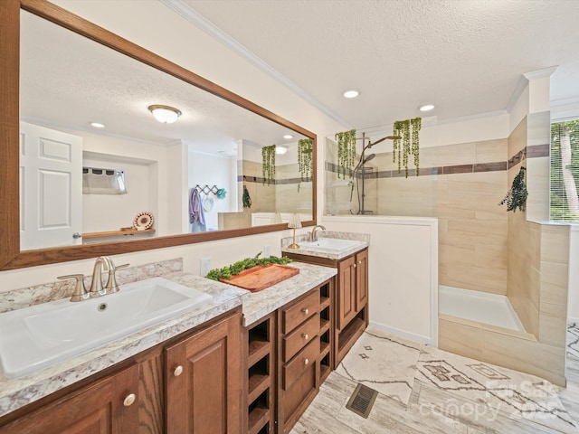 601 Lhasa Apso Ln, Iron Station, NC 28080 - full bathroom featuring a textured ceiling, double vanity, a walk in shower, and recessed lighting