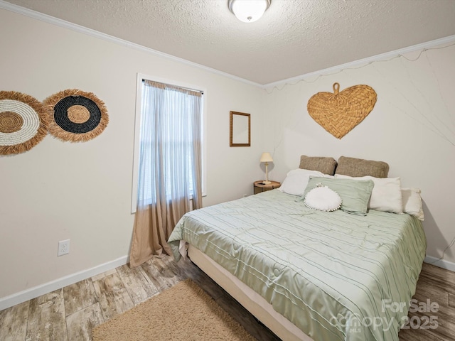601 Lhasa Apso Ln, Iron Station, NC 28080 - bedroom featuring wood finished floors, crown molding, and a textured ceiling