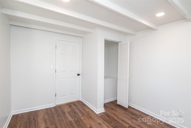 678 Wagner St, Troutman, NC 28166 - unfurnished bedroom featuring dark wood-type flooring, recessed lighting, a closet, and beamed ceiling