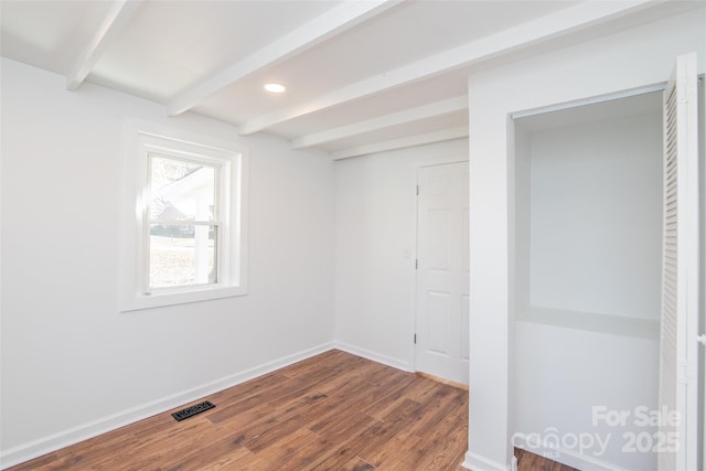678 Wagner St, Troutman, NC 28166 - unfurnished bedroom with beamed ceiling, dark wood-style floors, and recessed lighting