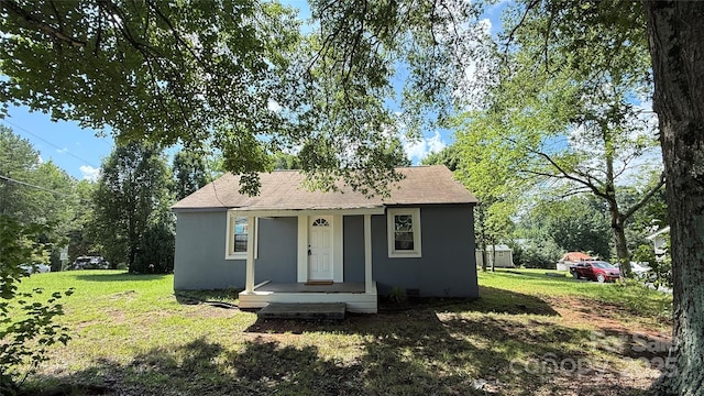 678 Wagner St, Troutman, NC 28166 - bungalow-style home featuring stucco siding, a front yard, and roof with shingles