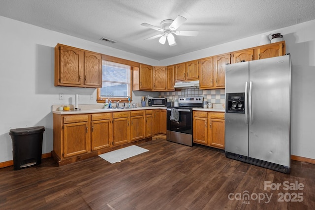 306 Forest Ave, Franklin, NC 28734 - kitchen featuring appliances with stainless steel finishes, under cabinet range hood, ceiling fan, dark wood finished floors, and a textured ceiling