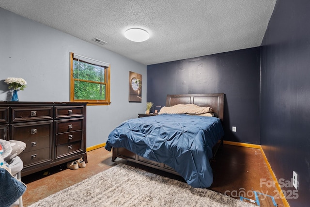 306 Forest Ave, Franklin, NC 28734 - bedroom with a textured ceiling and baseboards