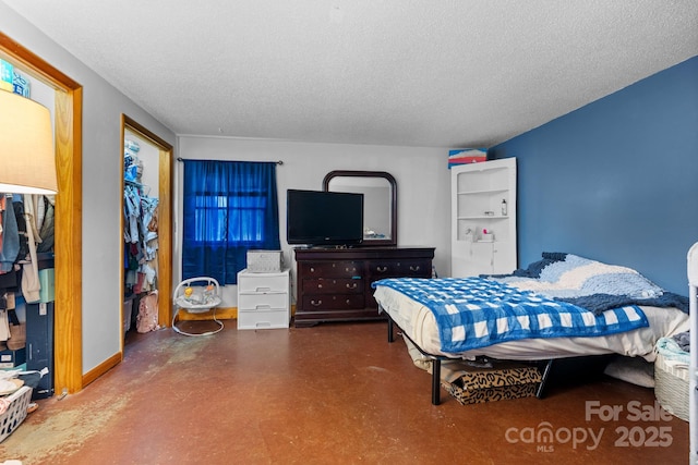306 Forest Ave, Franklin, NC 28734 - bedroom with a textured ceiling and finished concrete flooring