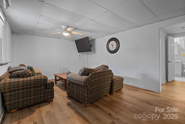 306 Forest Ave, Franklin, NC 28734 - living room with a paneled ceiling, light wood-style flooring, and a ceiling fan