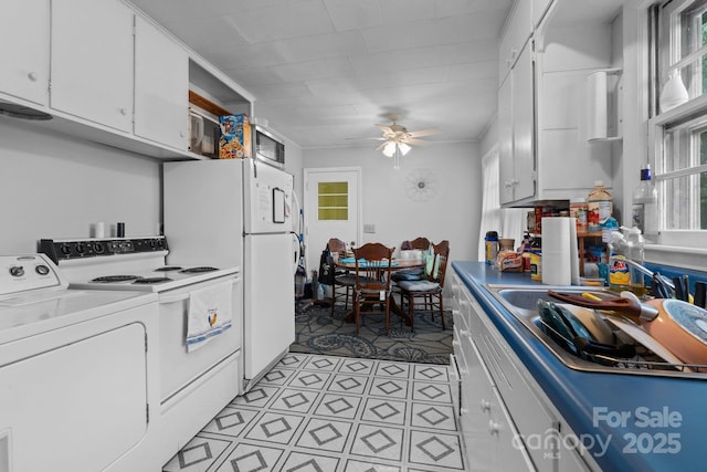 306 Forest Ave, Franklin, NC 28734 - kitchen featuring washer / clothes dryer, white cabinets, white appliances, a ceiling fan, and plenty of natural light