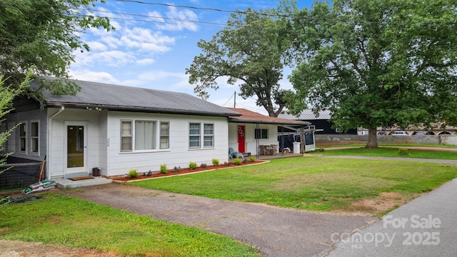 306 Forest Ave, Franklin, NC 28734 - single story home featuring a front lawn and roof with shingles