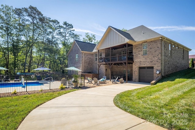 2545 10th Street Ct NE, Hickory, NC 28601 - view of front of home with brick siding, a balcony, concrete driveway, and a garage