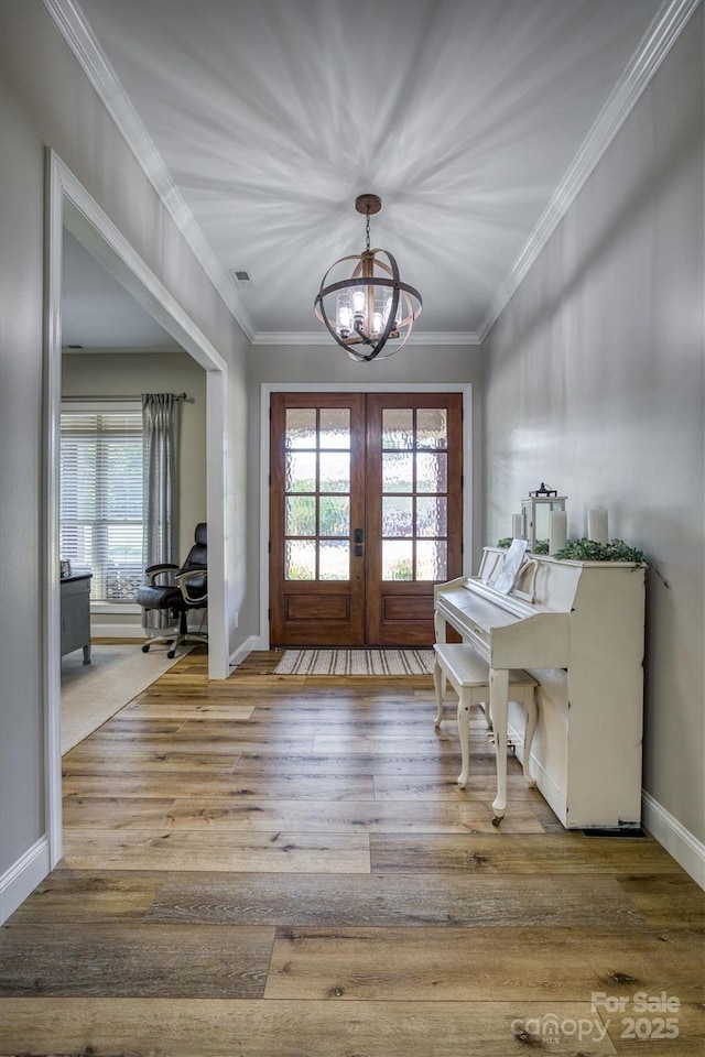 2545 10th Street Ct NE, Hickory, NC 28601 - entryway with a chandelier, plenty of natural light, wood finished floors, french doors, and crown molding