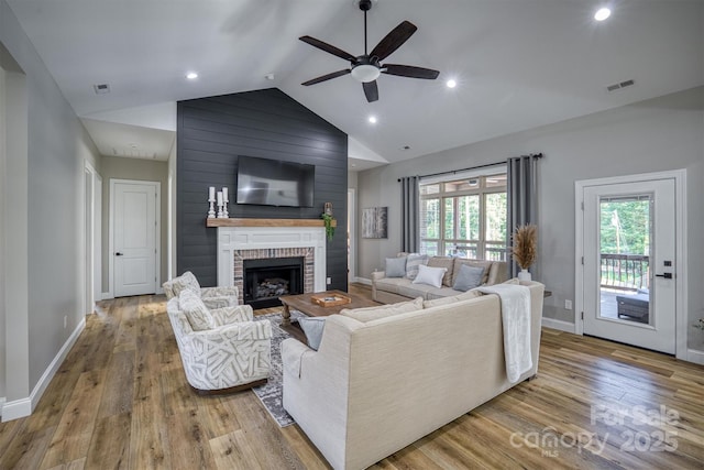 2545 10th Street Ct NE, Hickory, NC 28601 - living area featuring lofted ceiling, a ceiling fan, wood finished floors, a fireplace, and recessed lighting