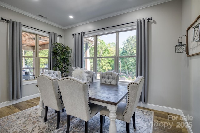 2545 10th Street Ct NE, Hickory, NC 28601 - dining area featuring wood finished floors, crown molding, plenty of natural light, and recessed lighting