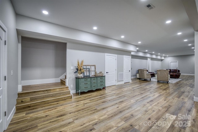 2545 10th Street Ct NE, Hickory, NC 28601 - living area with wood finished floors, stairway, and recessed lighting