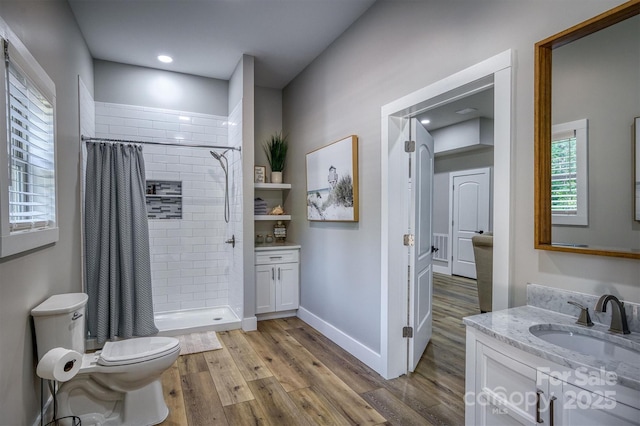 2545 10th Street Ct NE, Hickory, NC 28601 - bathroom featuring vanity, wood finished floors, and a stall shower