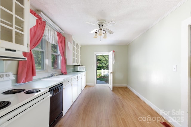 221 Kings Mountain St, Clover, SC 29710 - kitchen with white appliances, light wood-style floors, light countertops, ceiling fan, and white cabinetry