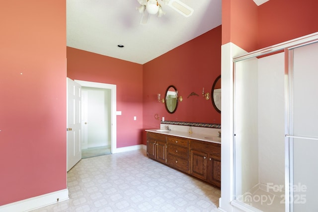 221 Kings Mountain St, Clover, SC 29710 - bathroom featuring a ceiling fan, tile patterned floors, double vanity, and a stall shower