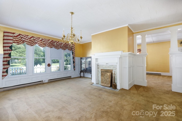 221 Kings Mountain St, Clover, SC 29710 - unfurnished living room featuring ornamental molding, carpet floors, a chandelier, a fireplace with flush hearth, and ornate columns