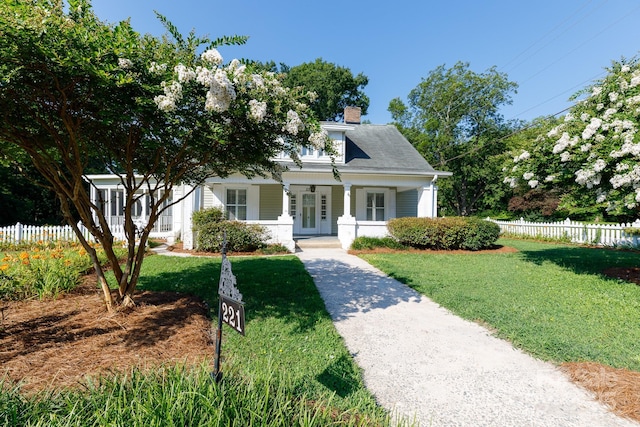 221 Kings Mountain St, Clover, SC 29710 - bungalow-style home featuring a chimney, french doors, and covered porch