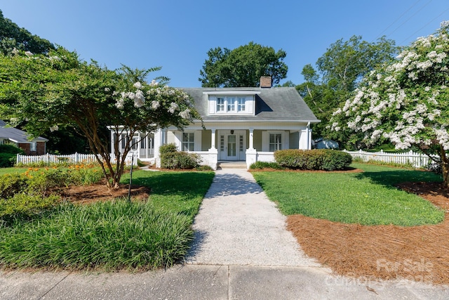 221 Kings Mountain St, Clover, SC 29710 - bungalow featuring a chimney, french doors, and a porch