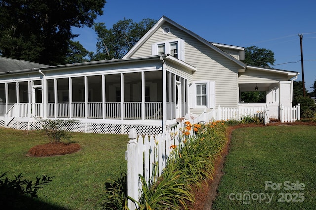 221 Kings Mountain St, Clover, SC 29710 - back of property with a sunroom and a yard