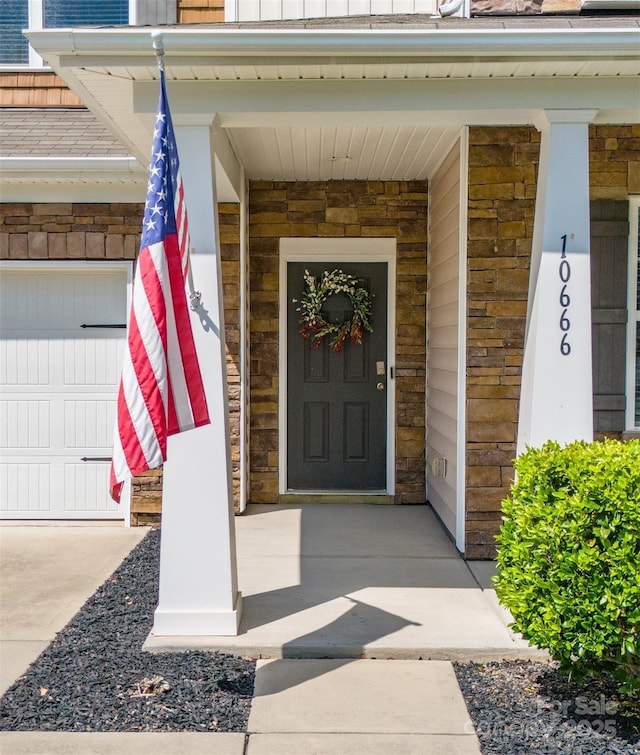 10666 Sapphire Trl, Davidson, NC 28036 - doorway to property featuring covered porch and a garage