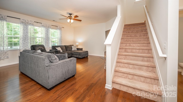 10666 Sapphire Trl, Davidson, NC 28036 - living room featuring ceiling fan, dark wood finished floors, and stairway