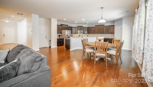 10666 Sapphire Trl, Davidson, NC 28036 - dining room featuring wood finished floors and recessed lighting