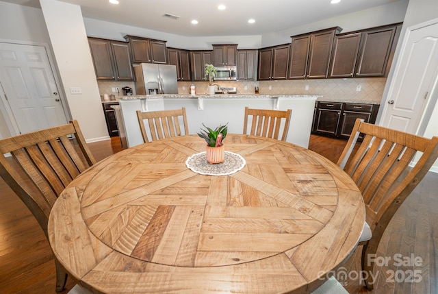10666 Sapphire Trl, Davidson, NC 28036 - dining room with recessed lighting and wood finished floors