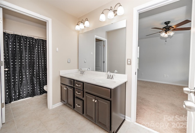 10666 Sapphire Trl, Davidson, NC 28036 - bathroom featuring a ceiling fan, double vanity, and tile patterned flooring