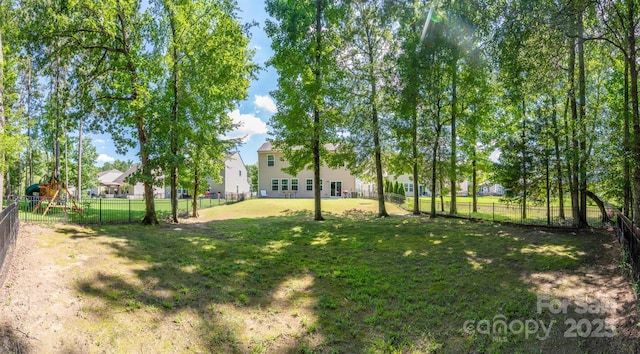 10666 Sapphire Trl, Davidson, NC 28036 - fenced backyard featuring a playground