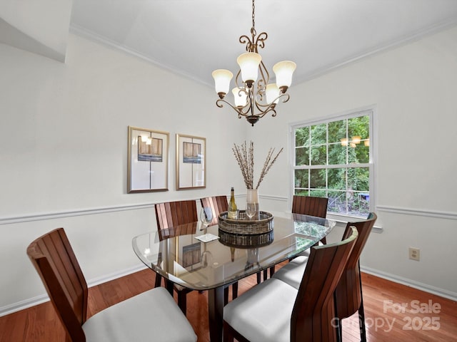 2808 Williams Station Rd, Matthews, NC 28105 - dining area featuring a chandelier, ornamental molding, and wood finished floors