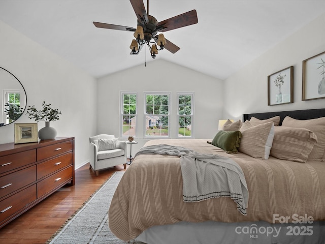 2808 Williams Station Rd, Matthews, NC 28105 - bedroom featuring wood finished floors, lofted ceiling, and ceiling fan