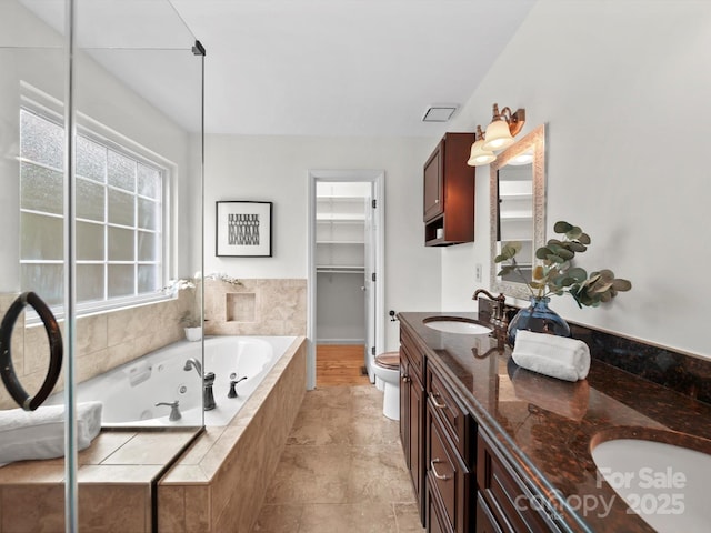 2808 Williams Station Rd, Matthews, NC 28105 - bathroom with double vanity and a whirlpool tub