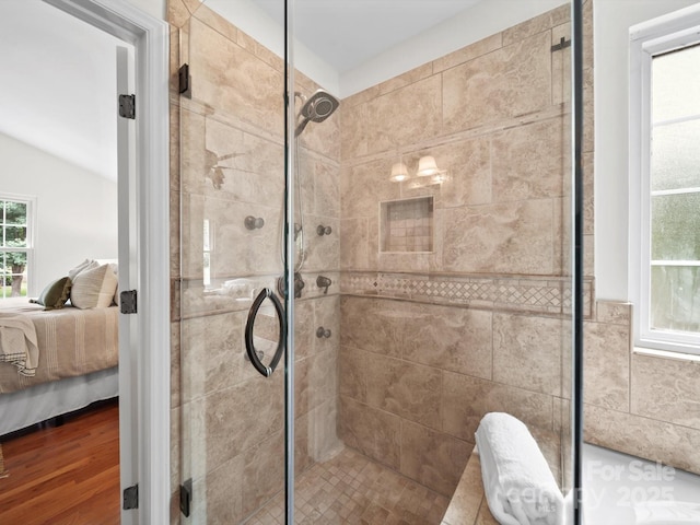 2808 Williams Station Rd, Matthews, NC 28105 - ensuite bathroom with a stall shower, vaulted ceiling, and wood finished floors