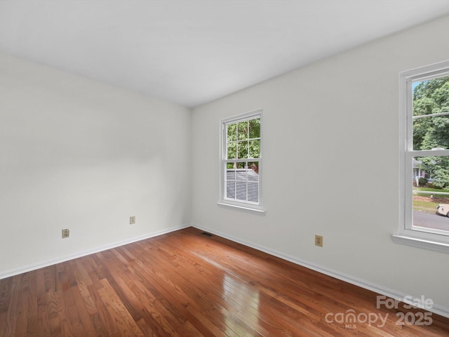 2808 Williams Station Rd, Matthews, NC 28105 - empty room with plenty of natural light and wood finished floors