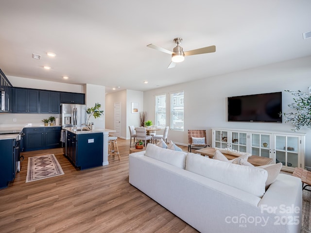 2511 Ruby Dixon Crossing Dr Unit 23, Gastonia, NC 28056 - living room featuring light wood-style flooring, a ceiling fan, and recessed lighting