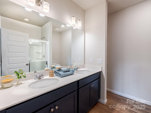 2511 Ruby Dixon Crossing Dr Unit 23, Gastonia, NC 28056 - bathroom with double vanity, a shower with shower door, and wood finished floors