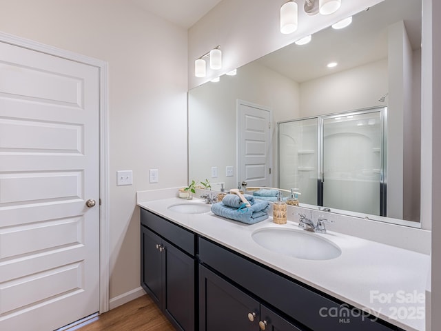 2511 Ruby Dixon Crossing Dr Unit 23, Gastonia, NC 28056 - full bathroom featuring double vanity, wood finished floors, and a stall shower