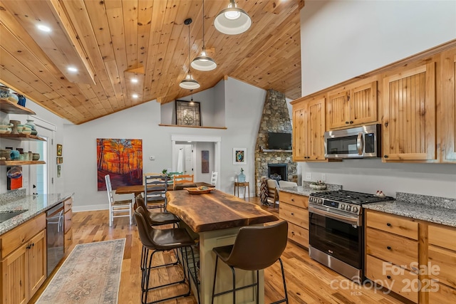 5283 Mount Olive Church Rd, Morganton, NC 28655 - kitchen with appliances with stainless steel finishes, wood ceiling, wood counters, high vaulted ceiling, and light wood-style flooring