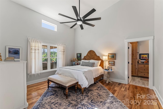 5283 Mount Olive Church Rd, Morganton, NC 28655 - bedroom with a high ceiling, light wood-style flooring, and a ceiling fan