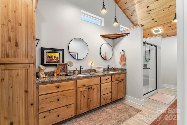 5283 Mount Olive Church Rd, Morganton, NC 28655 - bathroom featuring a stall shower, wooden ceiling, double vanity, wood finished floors, and high vaulted ceiling