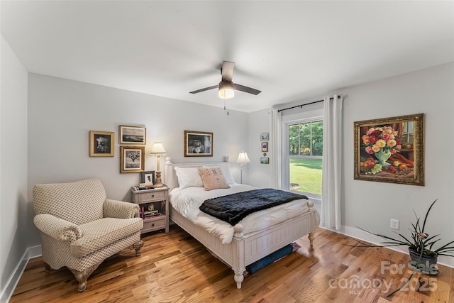 5283 Mount Olive Church Rd, Morganton, NC 28655 - bedroom with light wood finished floors and ceiling fan