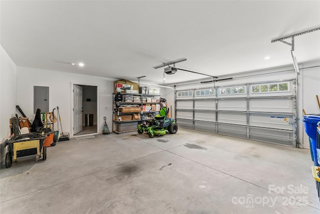 5283 Mount Olive Church Rd, Morganton, NC 28655 - garage featuring a garage door opener, electric panel, and recessed lighting