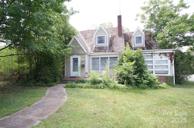 1400 Central Dr, Kannapolis, NC 28083 - cape cod-style house with a front yard and a chimney