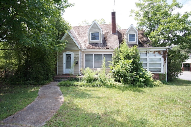 1400 Central Dr, Kannapolis, NC 28083 - cape cod-style house featuring a front yard and a chimney