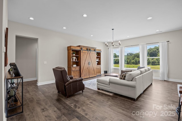 1140 Shinnville Rd, Cleveland, NC 27013 - living room with dark wood-style flooring, a chandelier, recessed lighting, and a barn door