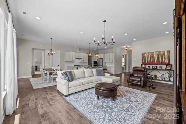 1140 Shinnville Rd, Cleveland, NC 27013 - living area with a chandelier, wood finished floors, and recessed lighting
